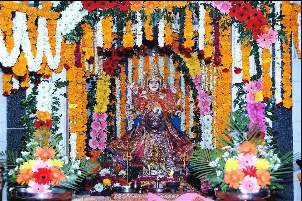 Maa Limbach enshrined and garlanded with marigold and rose for the Samaj's Navratri celebration